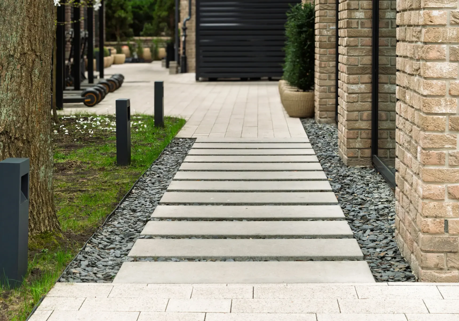 Modern walkway with clean lines and gravel borders.